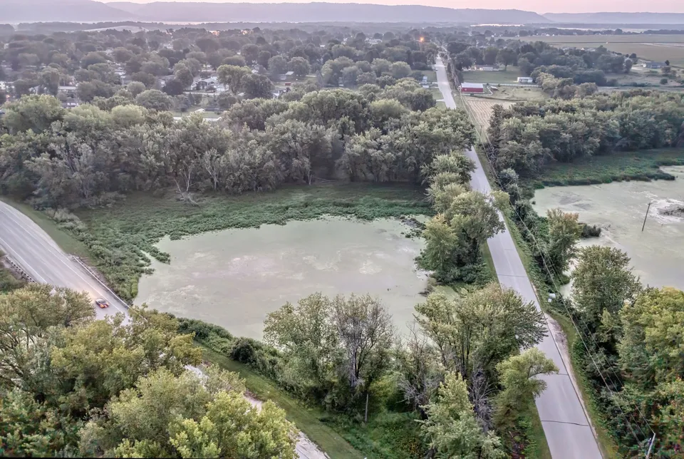 Drone image showcasing roads, lake, and forest in rural Wabasha, MN, during summer.